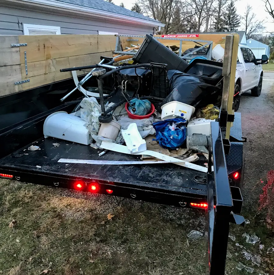 Roll-off dumpster delivered to a residential driveway in Central